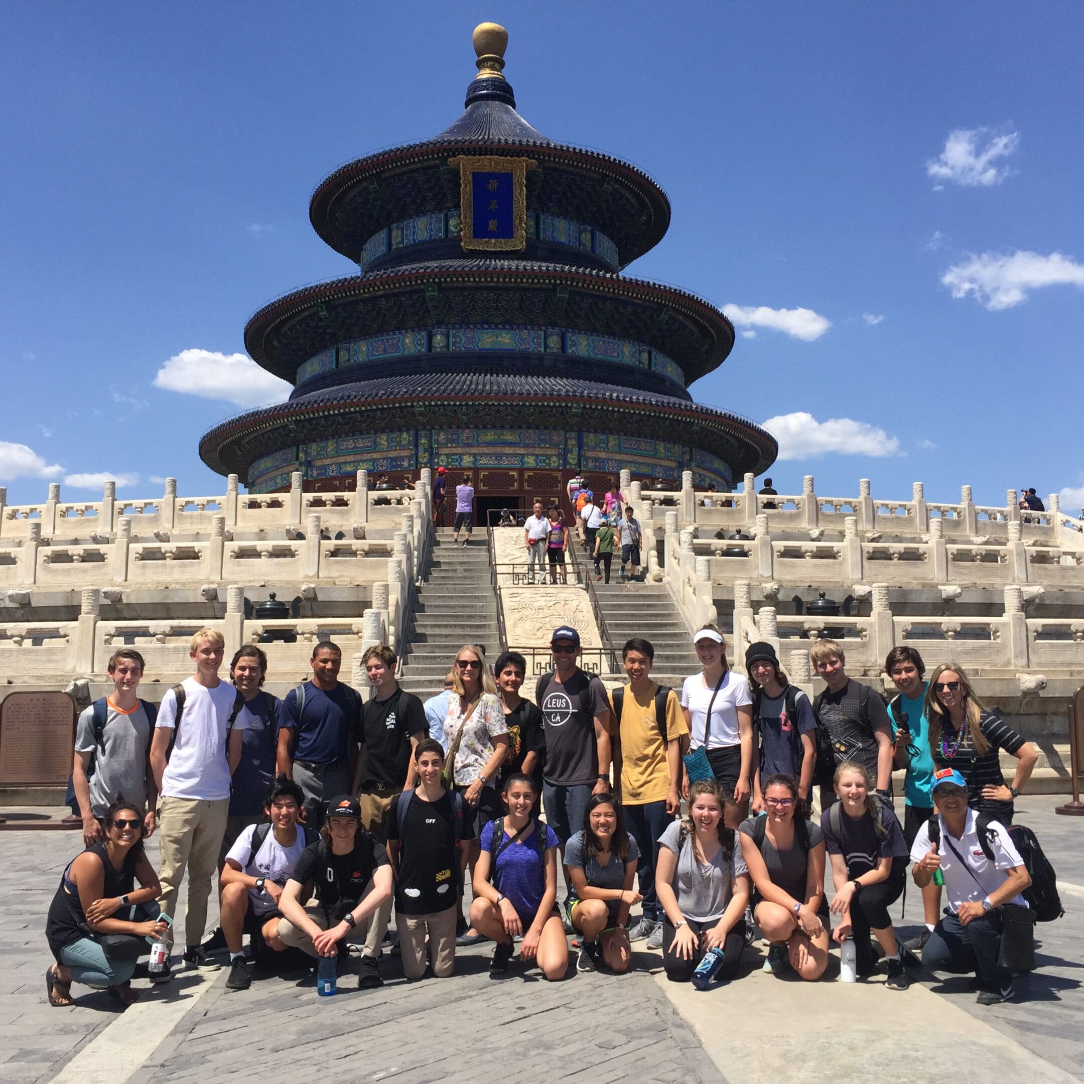 A group of people standing in front of a building.